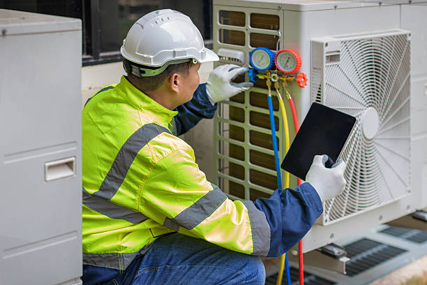 Professional Heat Pump Repair technician working in Mc Calla, AL